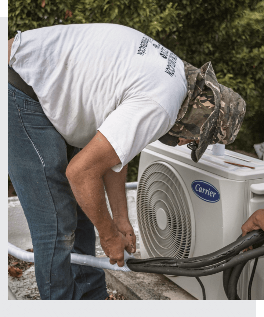 HVAC technician reviewing equipment performance with a homeowner