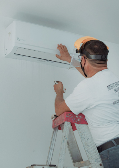 Technician performing duct sealing and airflow balancing